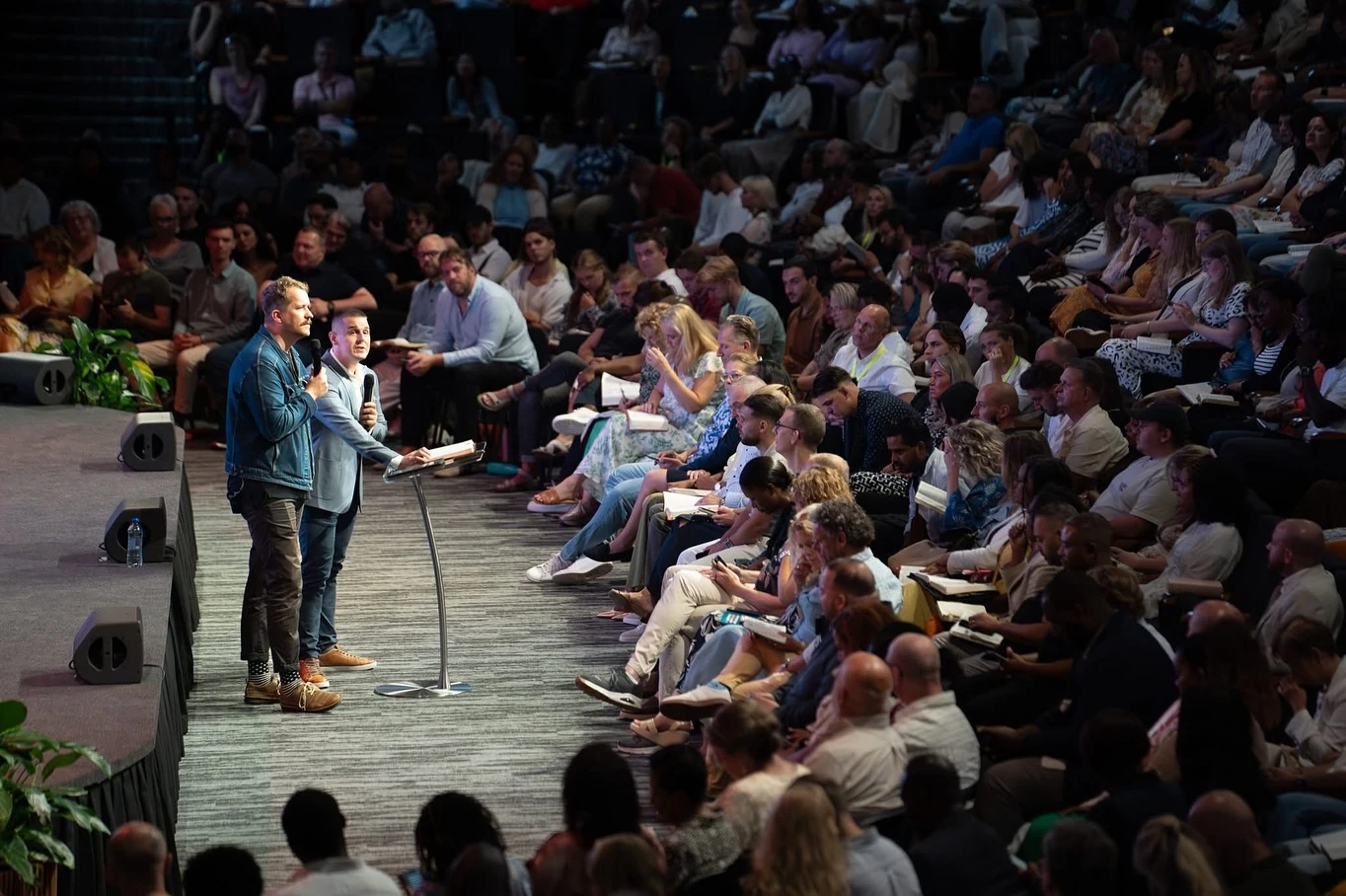 Preaching to a large congregation during a revival meeting